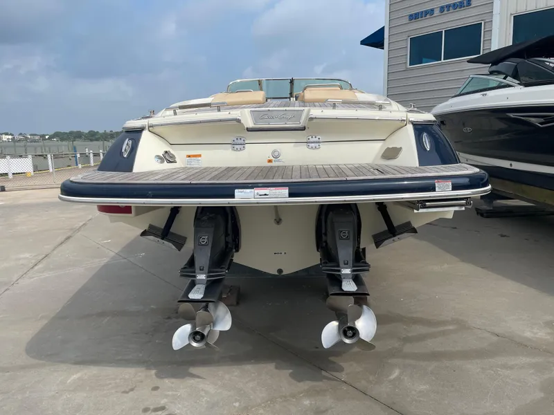 Slide: The Image of 2013 Chris-Craft Launch 32 boat, rear view, docked at marina. - 30