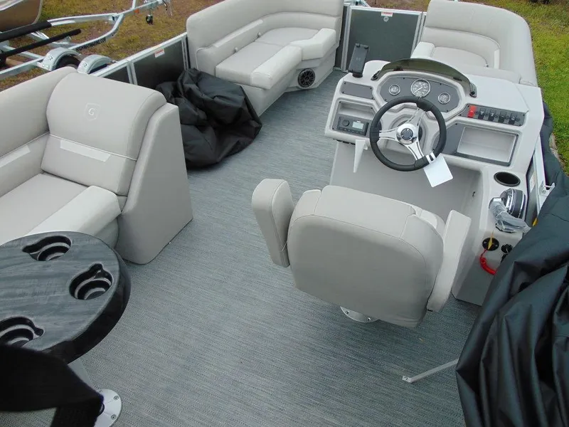 Slide: The Image of 2024 Godfrey Xperience 1880 CX pontoon boat interior with helm, seating, and cup holders. - 10
