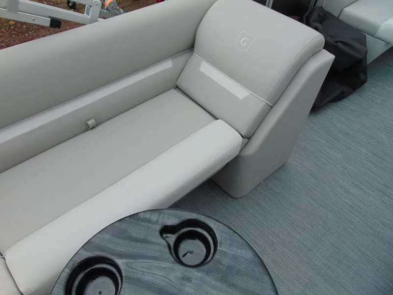 Slide: The Image of 2024 Godfrey Xperience 1880 CX boat interior with comfortable seating and cup holders. - 11