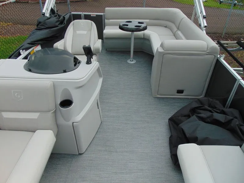 Slide: The Image of 2024 Godfrey Xperience 1880 CX pontoon boat interior with seating and table. - 4