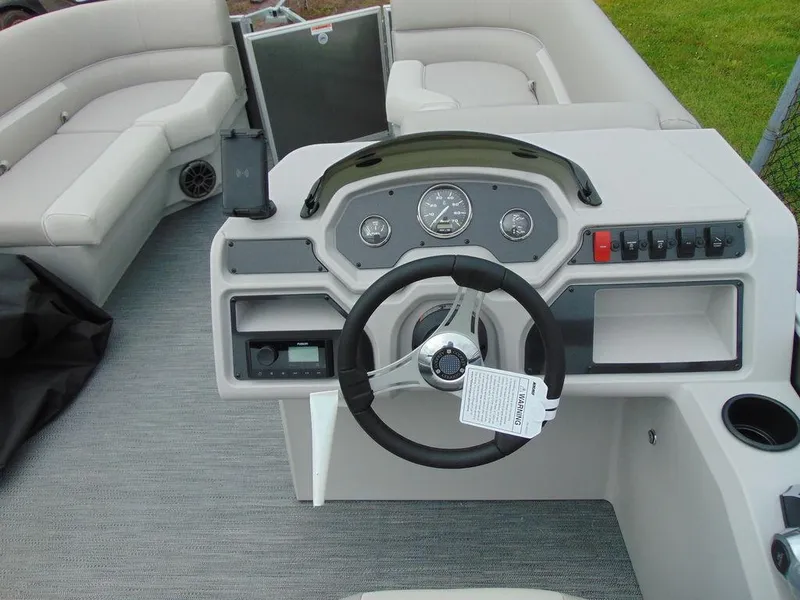 Slide: The Image of 2024 Godfrey Xperience 1880 CX boat interior with steering wheel and dashboard. - 7
