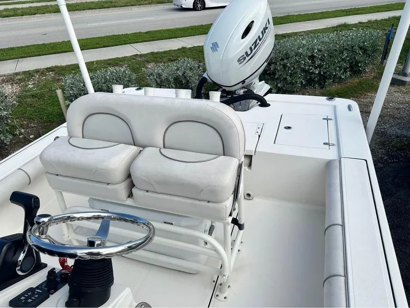 Slide: The Image of 2022 Sea Born FX24 boat interior with Suzuki outboard motor. - 4
