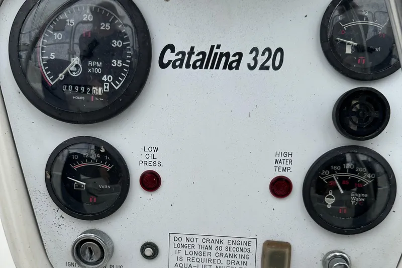 Slide: The Image of Control panel of a 1994 Catalina 320 sailboat with gauges and warning indicators. - 10
