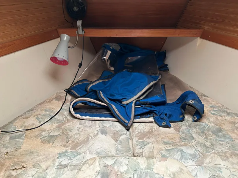 Slide: The Image of V-berth cabin of 1994 Catalina 320 sailboat with blue sail and reading lamp. - 16