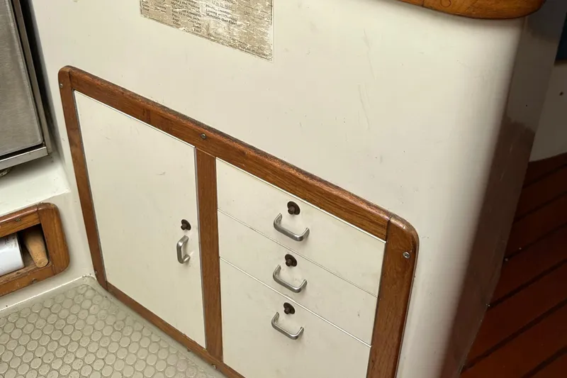 Slide: The Image of Cabinet and drawers on a 1994 Catalina 320 sailboat interior. - 19