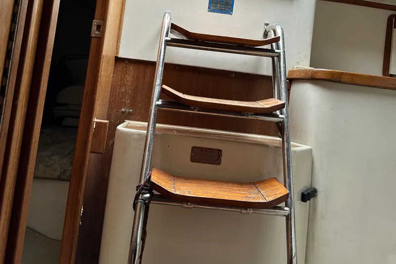 Slide: The Image of Ladder inside 1994 Catalina 320 sailboat cabin, wooden steps, compact interior design. - 29