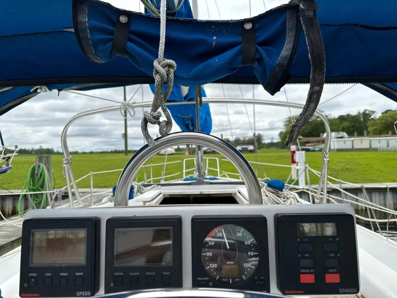Slide: The Image of Cockpit view of a 1994 Catalina 320 sailboat with navigation instruments. - 4