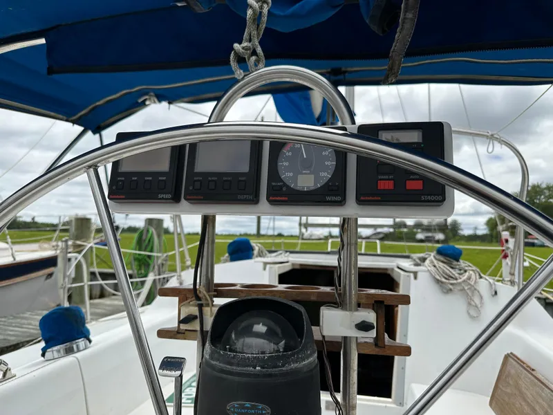 Slide: The Image of Cockpit view of a 1994 Catalina 320 sailboat with navigation instruments. - 5