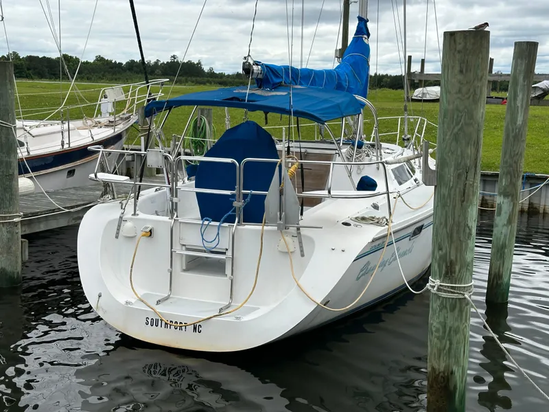 Slide: The Image of 1994 Catalina 320 sailboat docked in Southport, NC marina. - 6