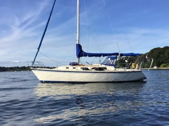 The Image of 1986 O'Day 35 sailboat on calm water under a clear blue sky. - 0