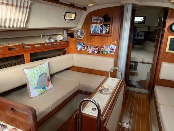 Slide: The Image of Interior of 1986 O'Day 35 sailboat with cozy seating and nautical decor. - 9