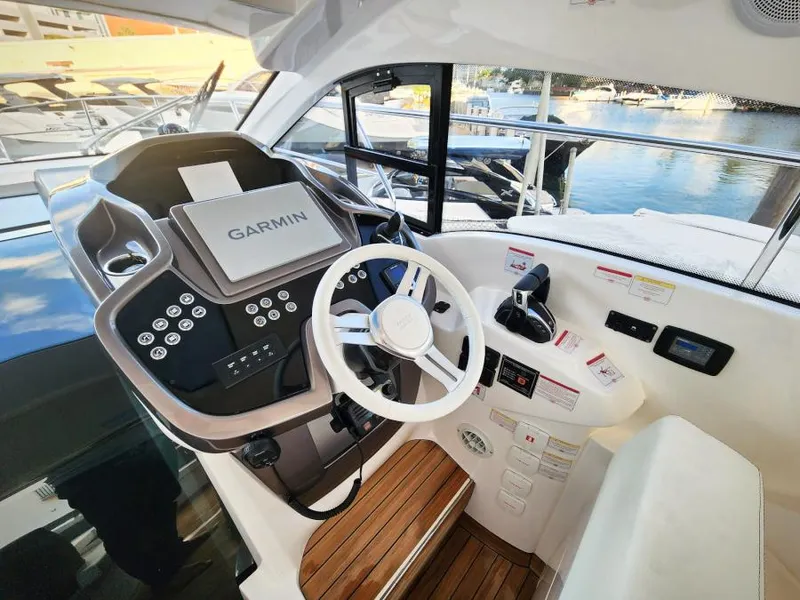 Slide: The Image of 2024 Sessa Marine C36 OB helm with Garmin navigation system and modern controls. - 14