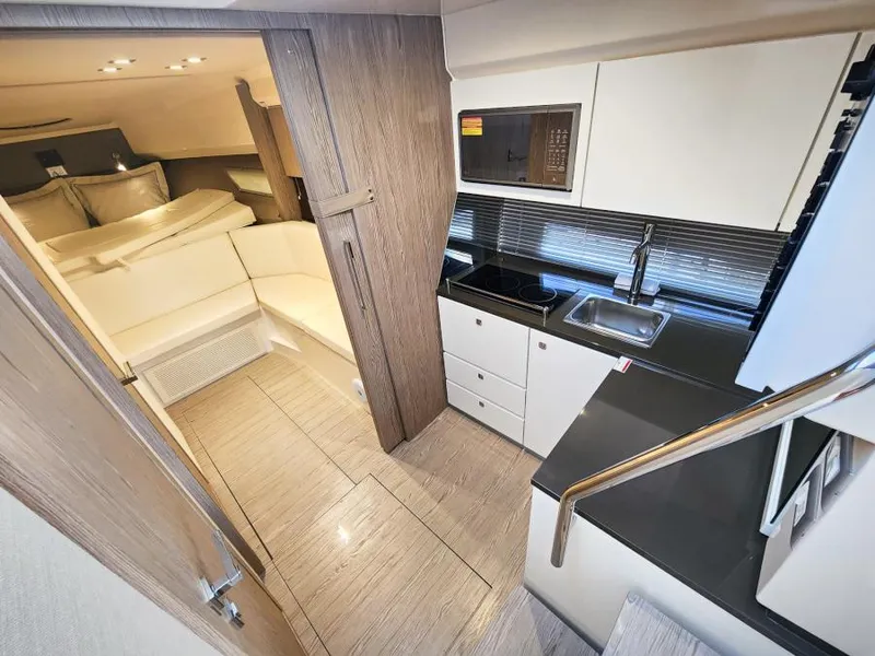 Slide: The Image of Interior of 2024 Sessa Marine C36 OB yacht, featuring modern kitchen and cozy seating area. - 15