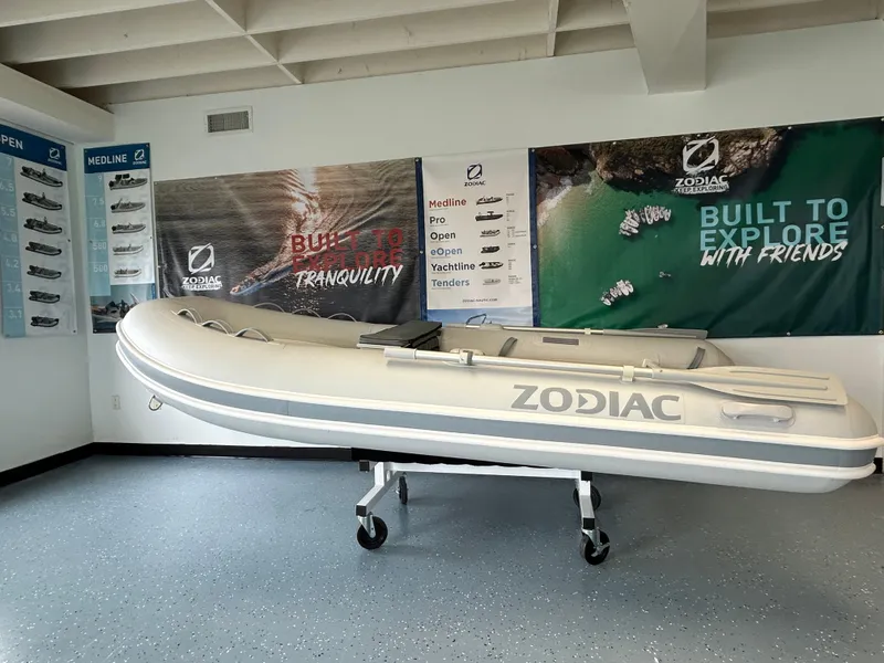 The Image of 2024 Zodiac Nomad RIB ALU 3.6 PVC boat displayed in showroom. - 0
