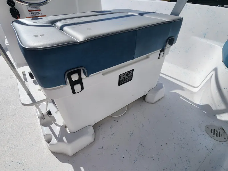 Slide: The Image of 2024 ALK2 Powerboats 18 CRS, cushioned cooler seat on deck. - 16