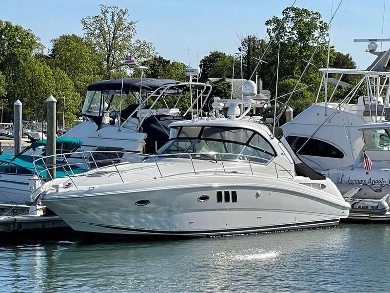 The Image of 2010 Sea Ray 390 Sundancer yacht docked at a marina. - 0