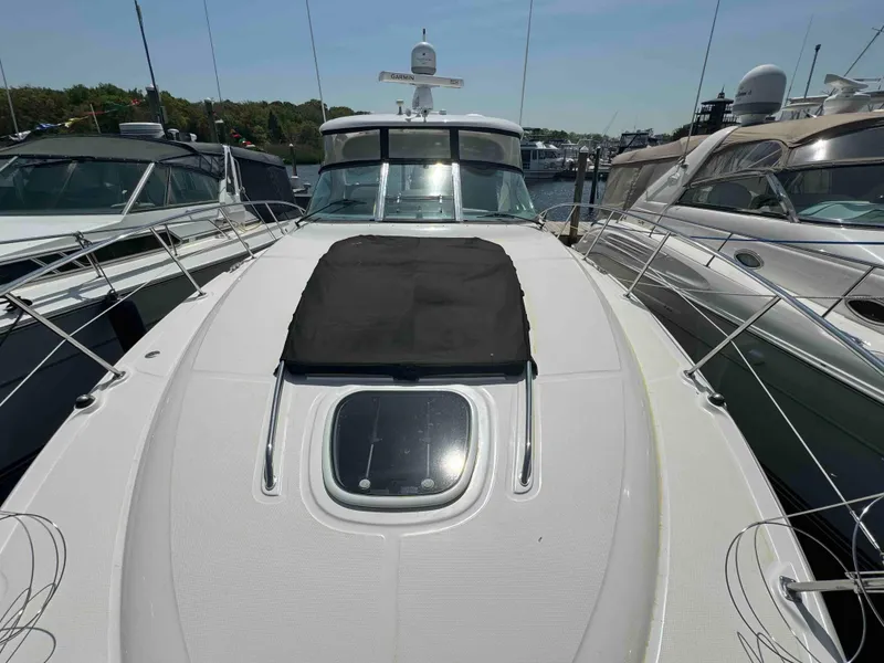 Slide: The Image of 2010 Sea Ray 390 Sundancer yacht docked at marina, front deck view. - 15