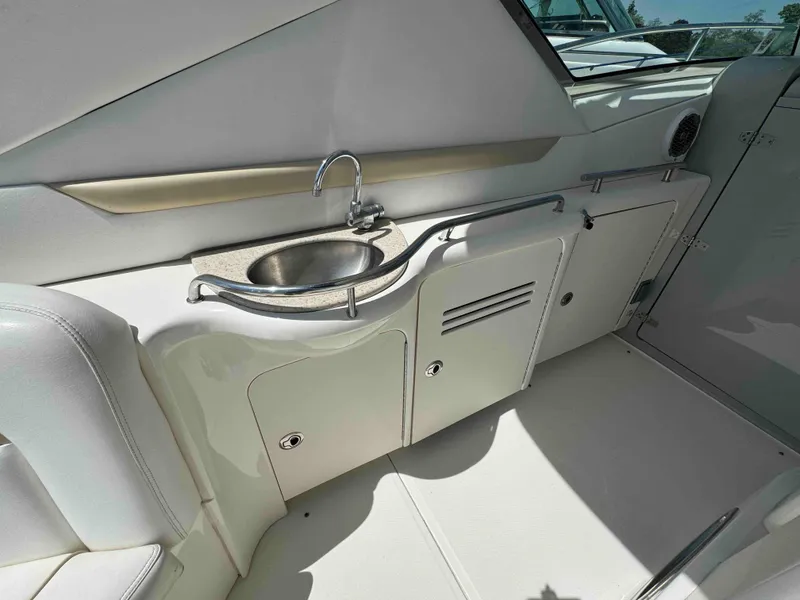 Slide: The Image of Interior view of 2010 Sea Ray 390 Sundancer yacht with sink and storage cabinets. - 20