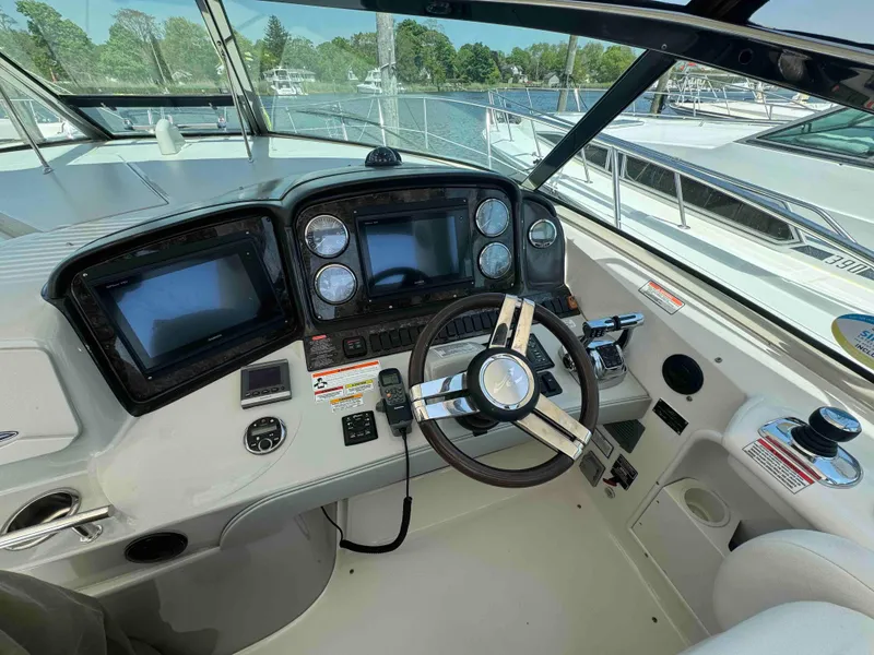 Slide: The Image of Cockpit of 2010 Sea Ray 390 Sundancer with modern navigation equipment. - 8