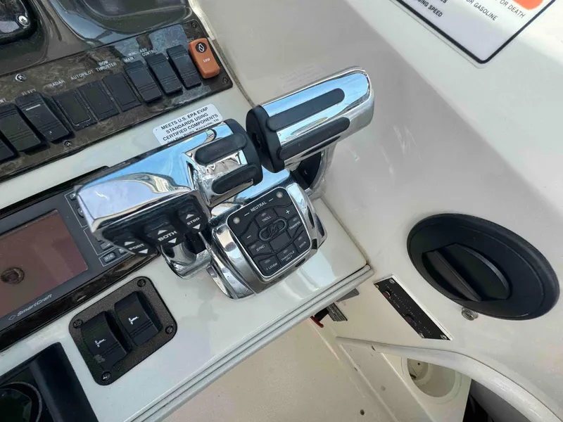 Slide: The Image of Sea Ray 390 Sundancer 2010 control panel with throttle and navigation controls. - 9