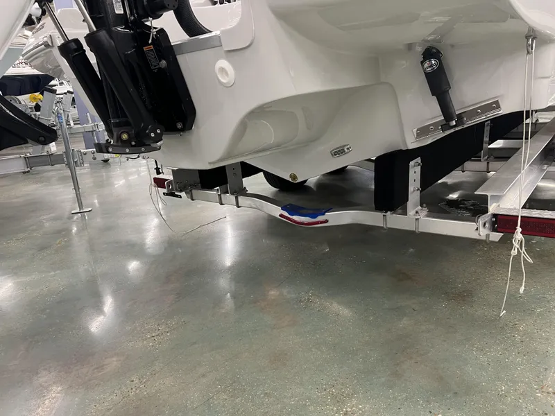 Slide: The Image of 2024 Crownline 270 XSS boat on a trailer in a showroom. - 3