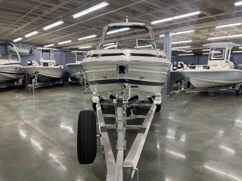Slide: The Image of 2024 Crownline 270 XSS boat on trailer in showroom. - 4