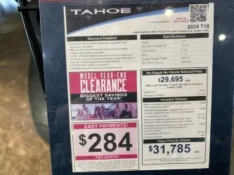 Slide: The Image of 2024 Tahoe T18 sale sign with clearance offer and monthly payment details. - 4