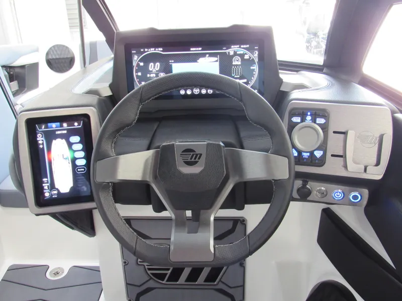 Slide: The Image of 2024 Malibu Wakesetter 23 MXZ dashboard with advanced controls and digital displays. - 11