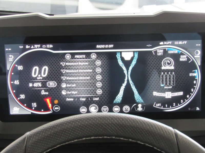 Slide: The Image of Dashboard display of 2024 Malibu Wakesetter 23 MXZ boat with control settings. - 14