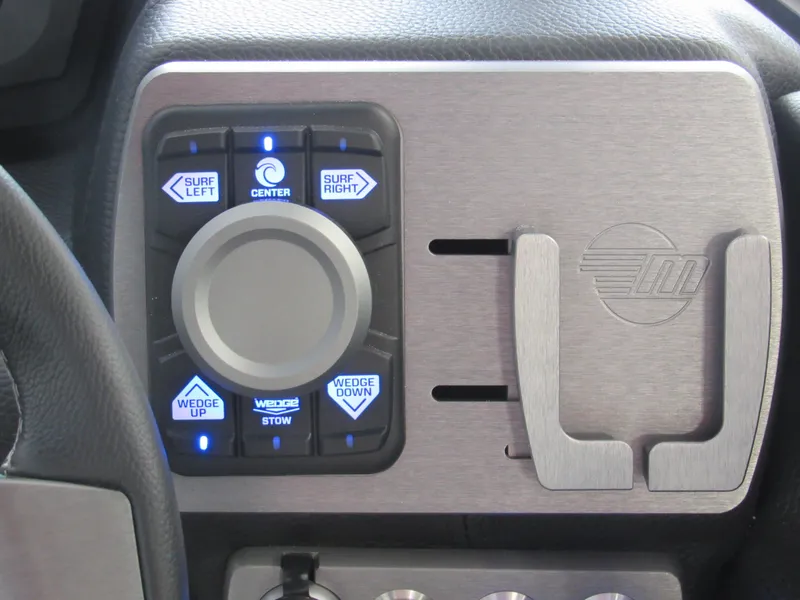 Slide: The Image of 2024 Malibu Wakesetter 23 MXZ control panel with surf and wedge adjustments. - 15