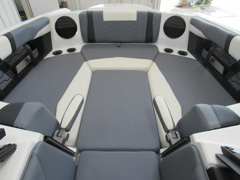 Slide: The Image of 2024 Malibu Wakesetter 23 MXZ interior with gray and white seating. - 16
