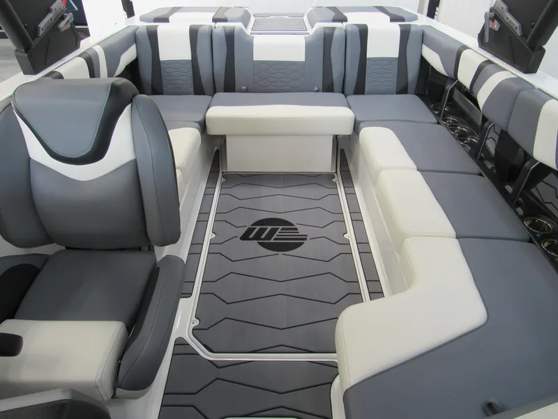 Slide: The Image of 2024 Malibu Wakesetter 23 MXZ interior with gray and white seating. - 17