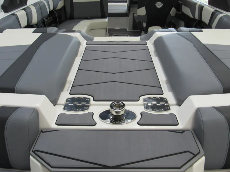 Slide: The Image of 2024 Malibu Wakesetter 23 MXZ boat interior with sleek gray seating and modern design. - 21
