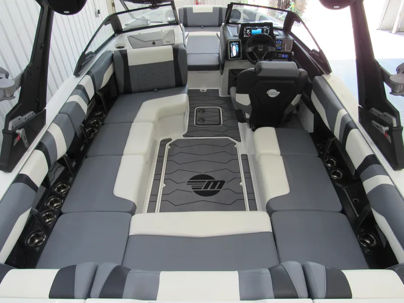 Slide: The Image of 2024 Malibu Wakesetter 23 MXZ interior with spacious seating and modern dashboard. - 5