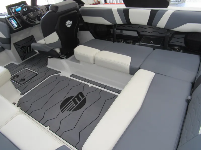 Slide: The Image of 2024 Malibu Wakesetter 23 MXZ interior with sleek, modern seating and dashboard design. - 6