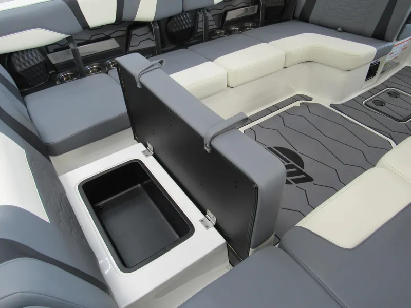 Slide: The Image of 2024 Malibu Wakesetter 23 MXZ interior seating with storage compartment. - 8