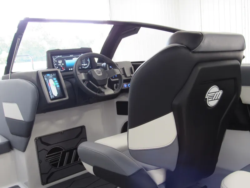Slide: The Image of 2024 Malibu Wakesetter 23 MXZ interior with modern dashboard and seating. - 9