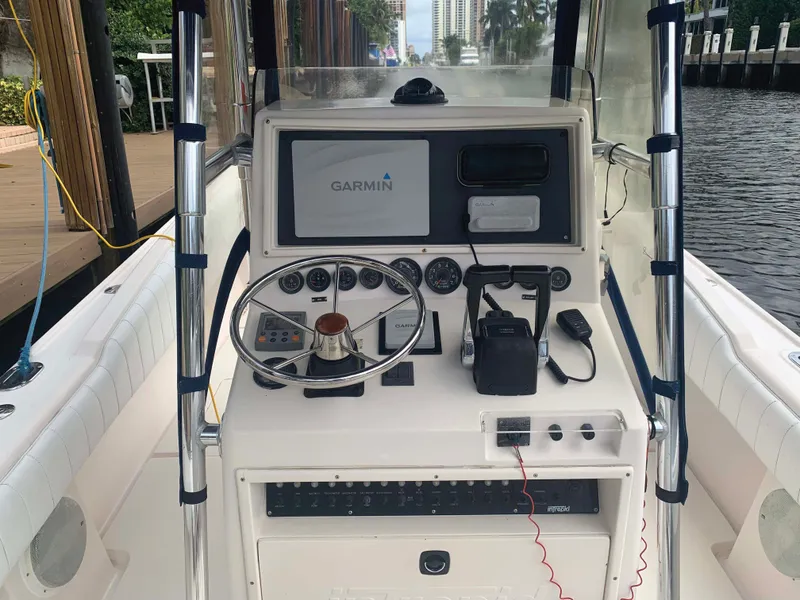 Slide: The Image of 1995 Intrepid 322 Cuddy boat dashboard with Garmin navigation system and steering wheel. - 3