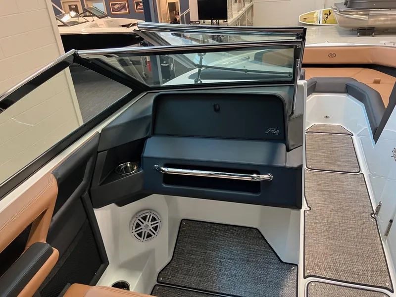 Slide: The Image of 2024 Cobalt R4 Surf boat interior with modern seating and sleek design. - 11