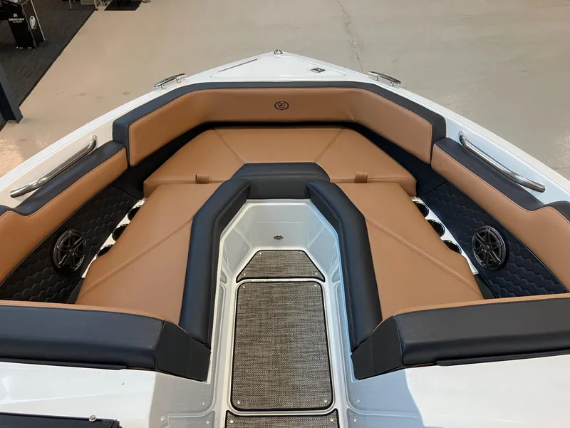 Slide: The Image of 2024 Cobalt R4 Surf boat with tan and black seating in the bow area. - 12