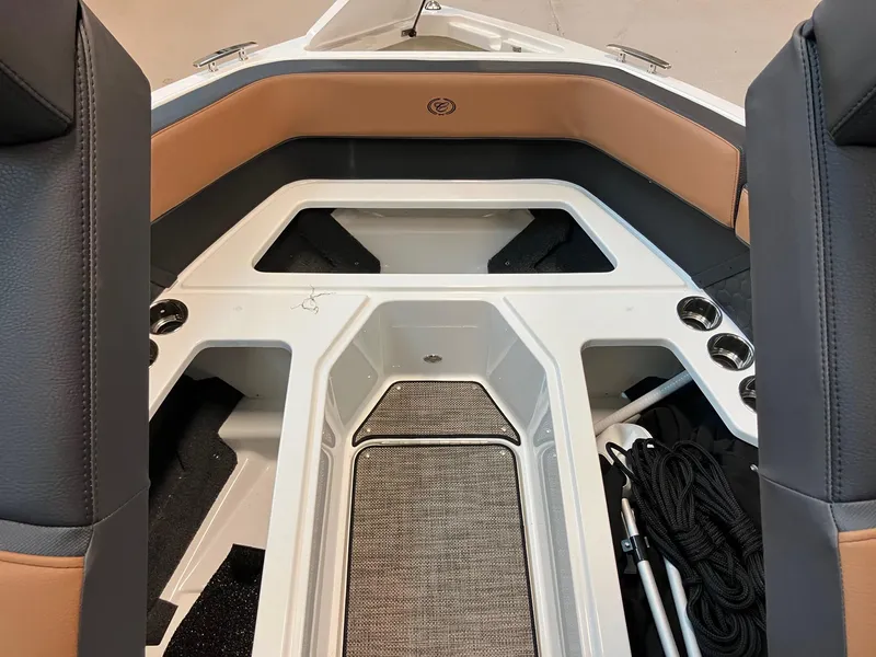 Slide: The Image of 2024 Cobalt R4 Surf boat interior with tan and black seating. - 13