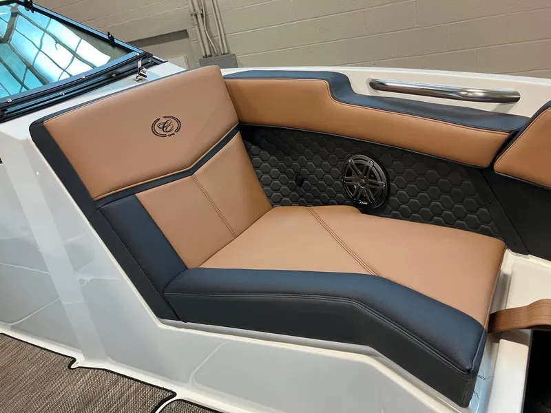 Slide: The Image of 2024 Cobalt R4 Surf boat interior with tan and black leather seating. - 14