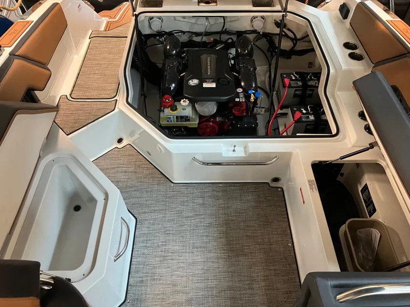 Slide: The Image of 2024 Cobalt R4 Surf boat engine compartment with seating and storage areas. - 17