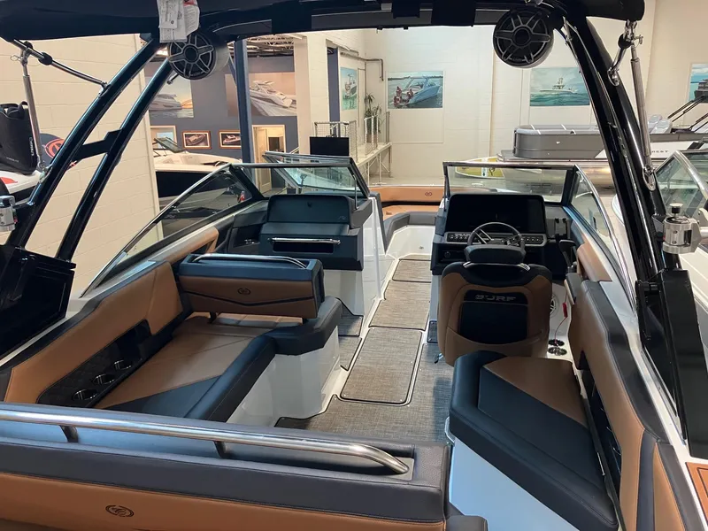 Slide: The Image of 2024 Cobalt R4 Surf boat interior with luxurious seating and modern dashboard. - 6