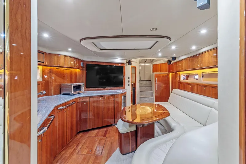 Slide: The Image of Luxurious interior of 2002 Sea Ray 550 Sundancer yacht with wood finishes and modern amenities. - 12