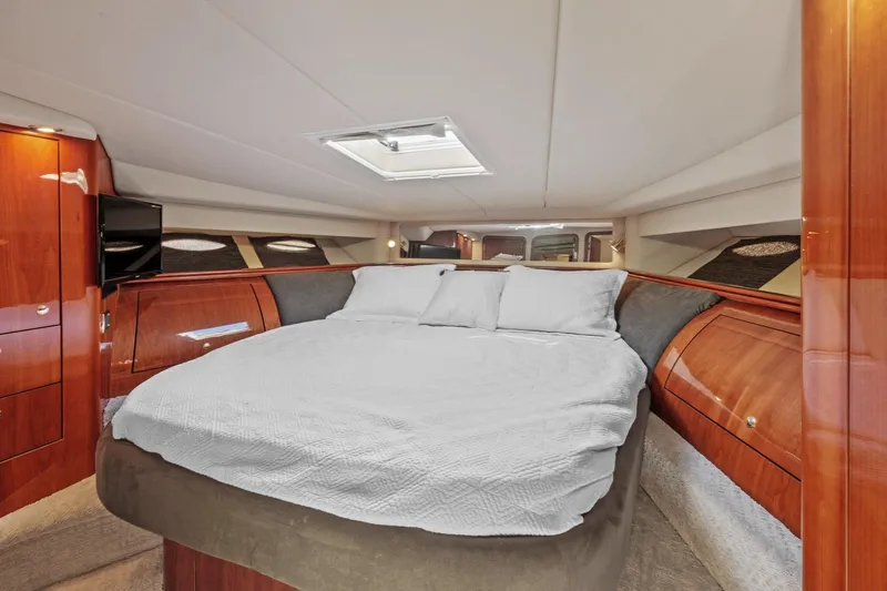 Slide: The Image of Luxurious bedroom interior of 2002 Sea Ray 550 Sundancer yacht with skylight. - 19