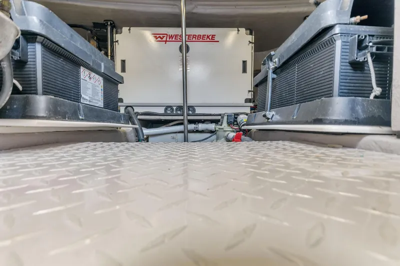 Slide: The Image of Engine room of a 2002 Sea Ray 550 Sundancer with Westerbeke generator. - 24