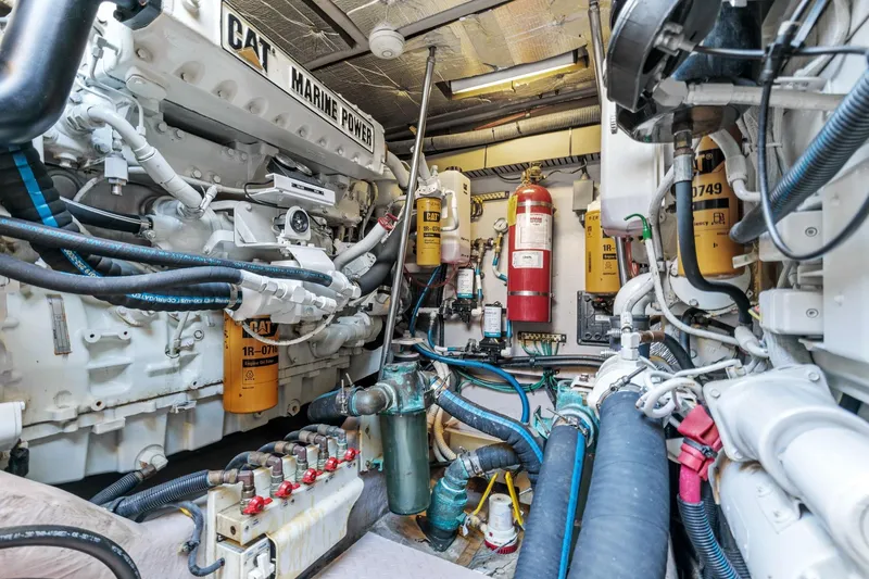 Slide: The Image of Engine room of a 2002 Sea Ray 550 Sundancer yacht with CAT Marine Power engines. - 25