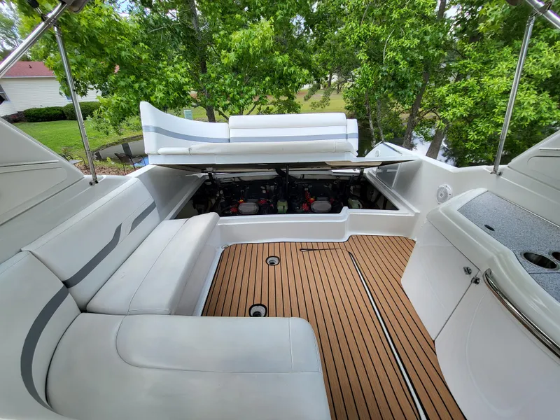 Slide: The Image of 2007 Formula 330 SS boat interior with white seating and teak flooring. - 19