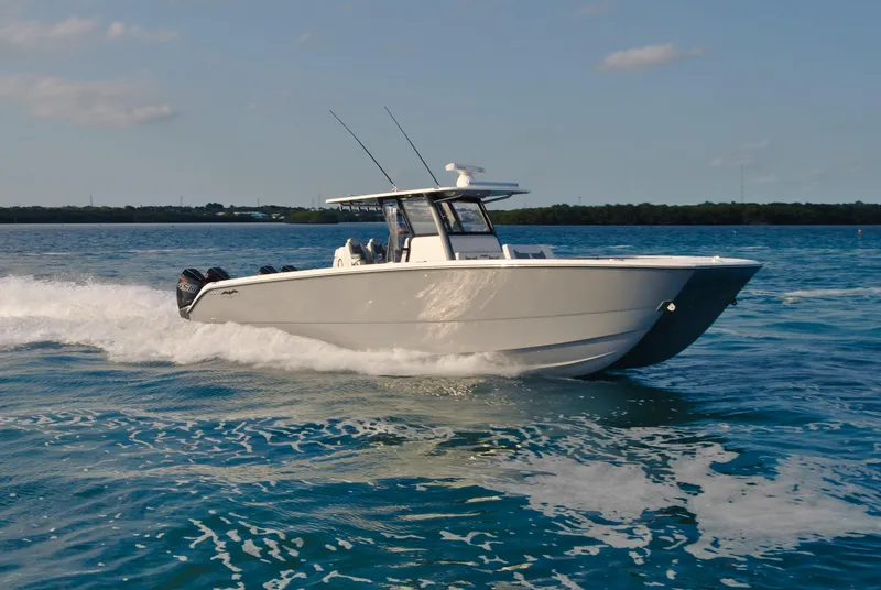 Slide: The Image of 2020 Invincible 40 Catamaran cruising on open water. - 10